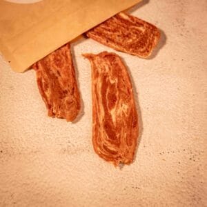 Snack natural de piel y pato para perros, ideal para masticar y cuidar la salud dental